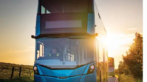 Buses being driven on a road