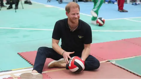 Prince Harry with a volleyball