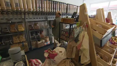 BBC Racks of food stuffs in the refill shop