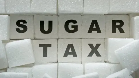 Getty Images Sugar tax written on sugar lumps