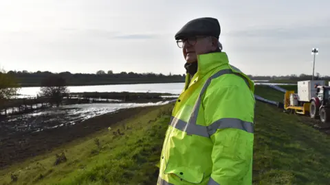 Fishlake's chief flood warden and chairman of the parish council, John Waite, at the pumping site used to reduce flood levels