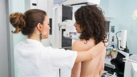 Getty Images Woman having mammogram