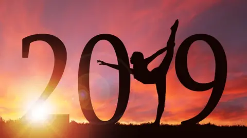 Getty Images 2019 and woman in yoga pose