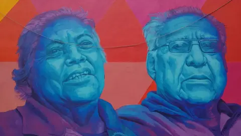 Duncan Tucker A mural showing local residents