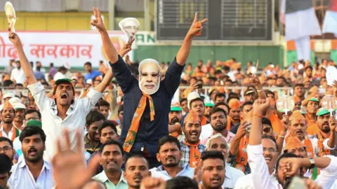 Getty Images Supporters of the Bharatiya Janata Party (BJP) shout during a rally in in Hyderabad in April.