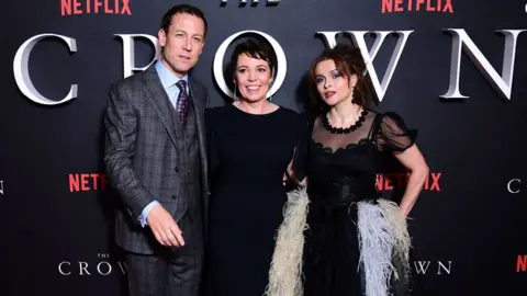 PA Media Tobias Menzies, Olivia Colman and Helena Bonham Carter