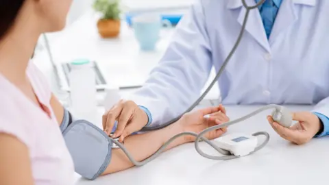 Getty Images Measuring blood pressure