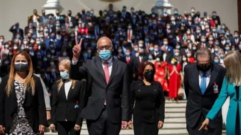 Reuters Jorge Rodriguez, elected candidate of Venezuela's United Socialist Party (PSUV), gestures after the swear-in ceremony of Venezuela's National Assembly new term, in Caracas, Venezuela, January 5, 2021