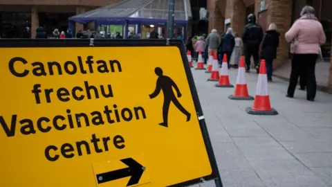 Getty Images A vaccination queue in Newport