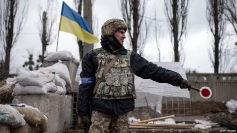 Getty Images Ukrainian soldier at checkpoint