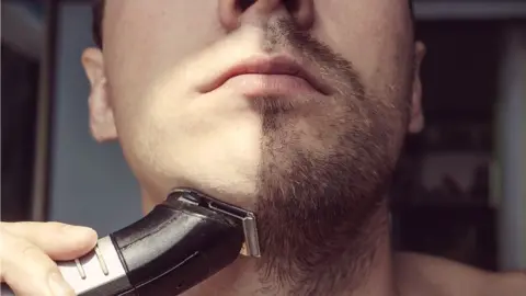 Getty Images Man shaving
