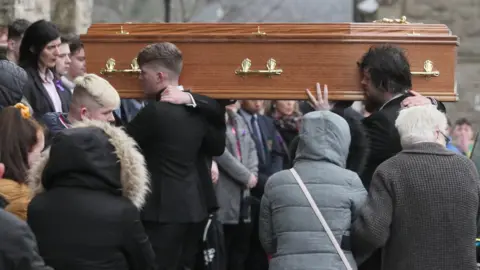 PA Morgan Barnard's coffin is carried into the church