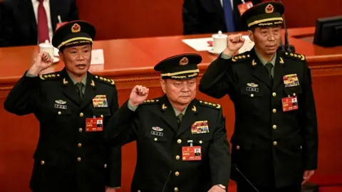 Reuters Zhang Youxia (C), newly-elected Vice Chairman of the Central Military Commission of the People's Republic of China, swears an oath with Central Military Commission members He Weidong and Li Shangfu after they were elected