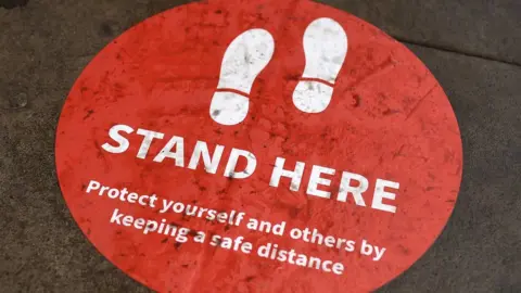 OLI SCARFF/Getty Images Warning sign