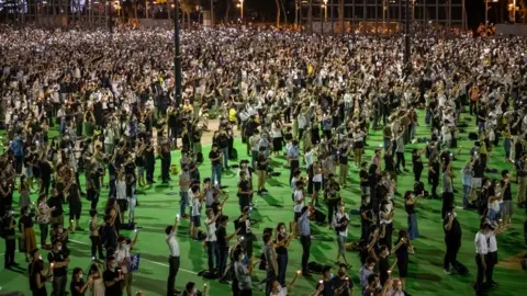 Getty Images People take part in a vigil to remember the victims of the 1989 Tiananmen Square Massacre in Hong Kong, on 4 June, 2020