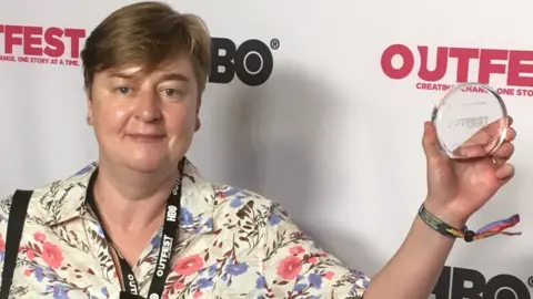 Rachel Dax Rachel Dax with her award at Outfest