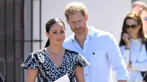 Getty Images Prince Harry and Meghan Markle in South Africa in 2019.