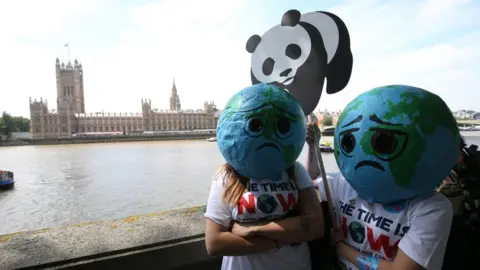 PA Media Sad earth protesters making their point in Westminster