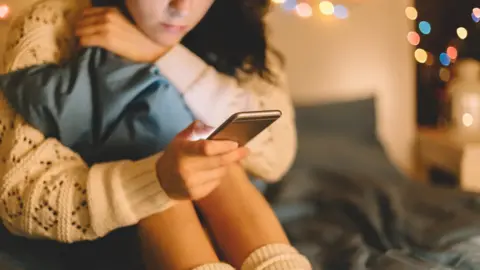 Getty Images Girl on phone (generic)