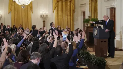 AFP via GETTY President Trump points at CNN's Jim Acosta during a media briefing in 2018