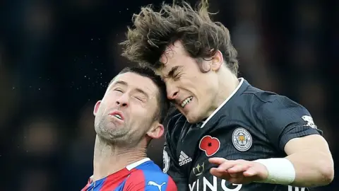 Leicester defender Caglar Soyuncu beats Palace's Gary Cahill to a header