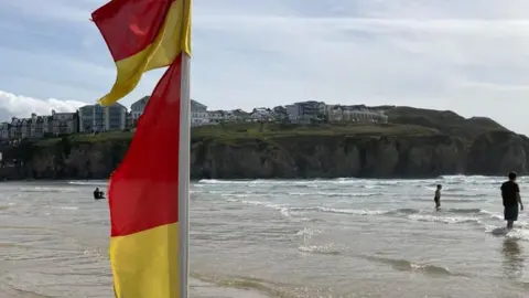 RNLI red and yellow flag on a beach