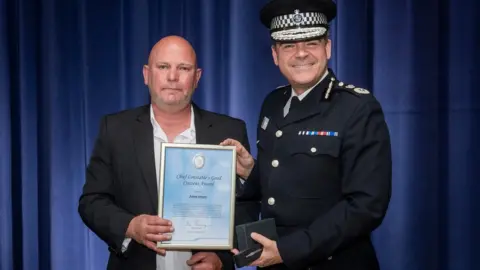 West Midlands Police Adrian Henefer receiving a good citizen award
