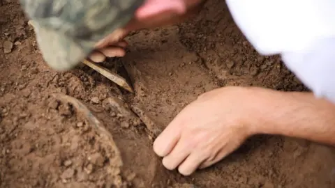 Vivian Paul Thomas Man digging in the ground