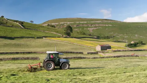 Getty Images A tractor at a farm