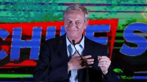 Chilean presidential candidate Jose Antonio Kast speaks after the partial results of the first round vote during the presidential elections, in Santiago, Chile, November 21, 2021.