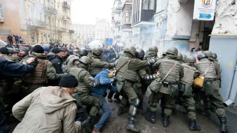 Reuters National Guard officers clash with supporters of Georgian former President Mikheil Saakashvili
