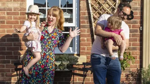 A family outside their home in Bedford