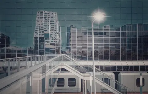 Pati John Buildings reflected in the glass side of a building in Netherlands