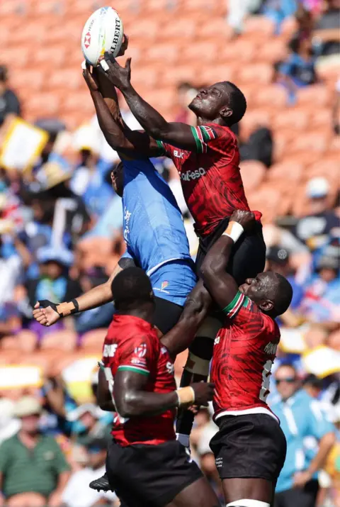 Getty Images Motu Opetai of Samoa and Herman Humwa of Kenya jump for the ball.