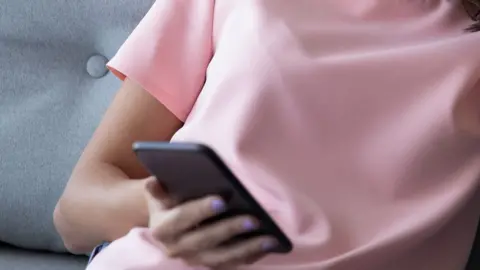 Getty Images Generic image of woman on phone