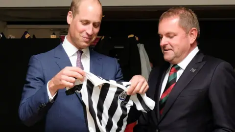 Reuters Prince William being given a Newcastle United shirt at the Great Exhibition of the North