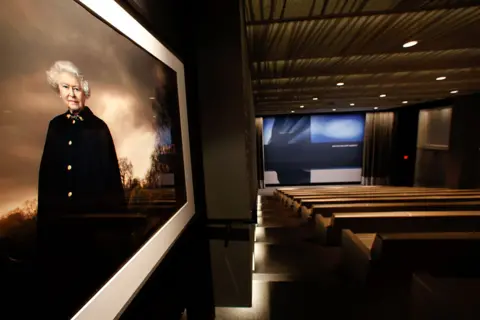 Getty Images A portrait of Queen Elizabeth by photographer Annie Leibovitz is on display inside the state of the art screening room at talent agency UTA in Beverly Hills on April 5, 2013.