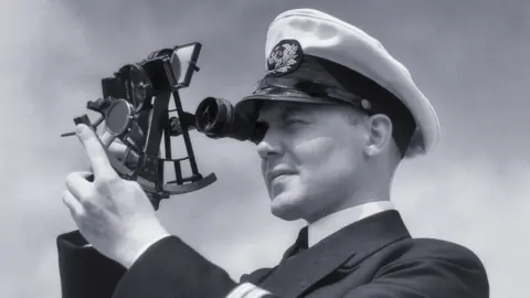 Getty Images Officer using a sextant in the 1930s