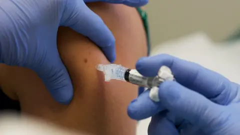 Getty Images Patient getting an injection