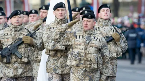 AFP Latvian troops on parade - file pic