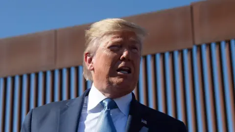 AFP US President Donald Trump visits the US-Mexico border