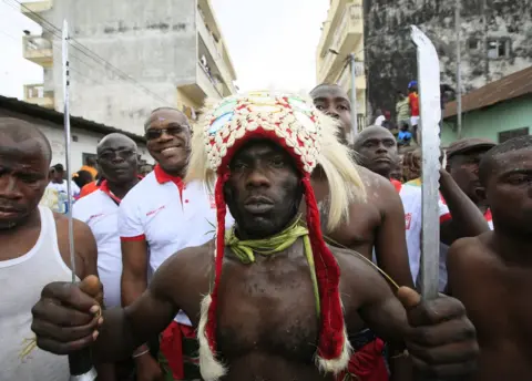 EPA Ivorian men dance in a parade during the Generation Festival in Abobodoume village, Ivory Coast, 08 September 2018.