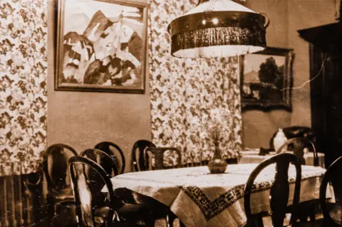 Sotheby's Kandinsky's painting on the wall of the dining room at Villa Stern