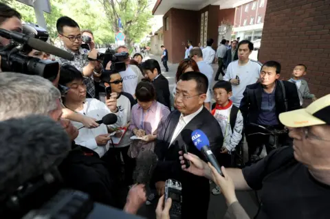 Getty Images Journalists interview Chinese rights lawyer Jiang Tianyong in Beijing in May 2012.