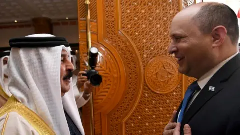 Reuters Bahrain's King Hamad Al Khalifa (L) meets Israeli Prime Minister Naftali Bennett (R) in Manama, Bahrain (15 February 2022)