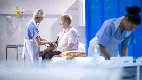 Getty Images patient having blood pressure checked in A&E