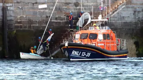 PEEL RNLI Lifeboat and dinghy at the breakwater
