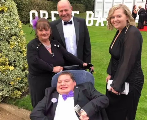 Christine Sketchley The Sketchley family with Myles' personal caring assistant