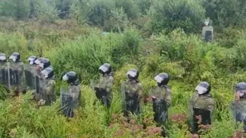 Lithuania border guard service A video showing Belarusian officers in riot gear near the Belarus-Lithuania border