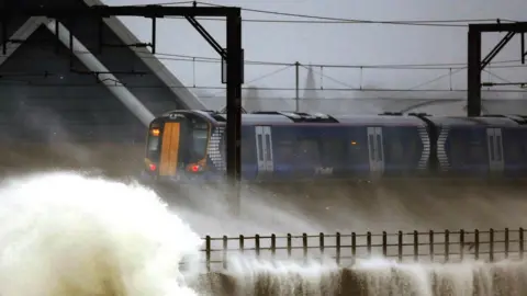 PA Media Train hit by gales in Scotland